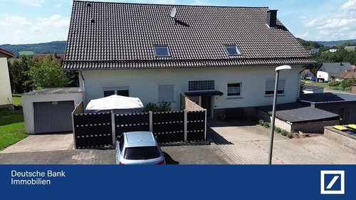 Hausfront - Charmante Eigentumswohnung mit Vermietungspotenzial in Braunshausen