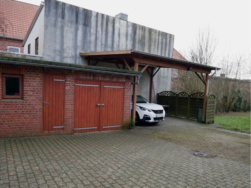 Ansicht auf Schuppen, Garage, Doppel-Carport - Einfamilienhaus mit 152,00 m² in Marne zum Kaufen