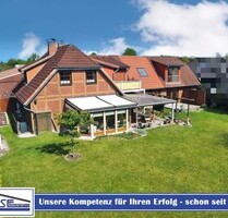 Zwei Wohneinheiten mit Gewerbeeinheit in Bad Schwartau, Langenfelde